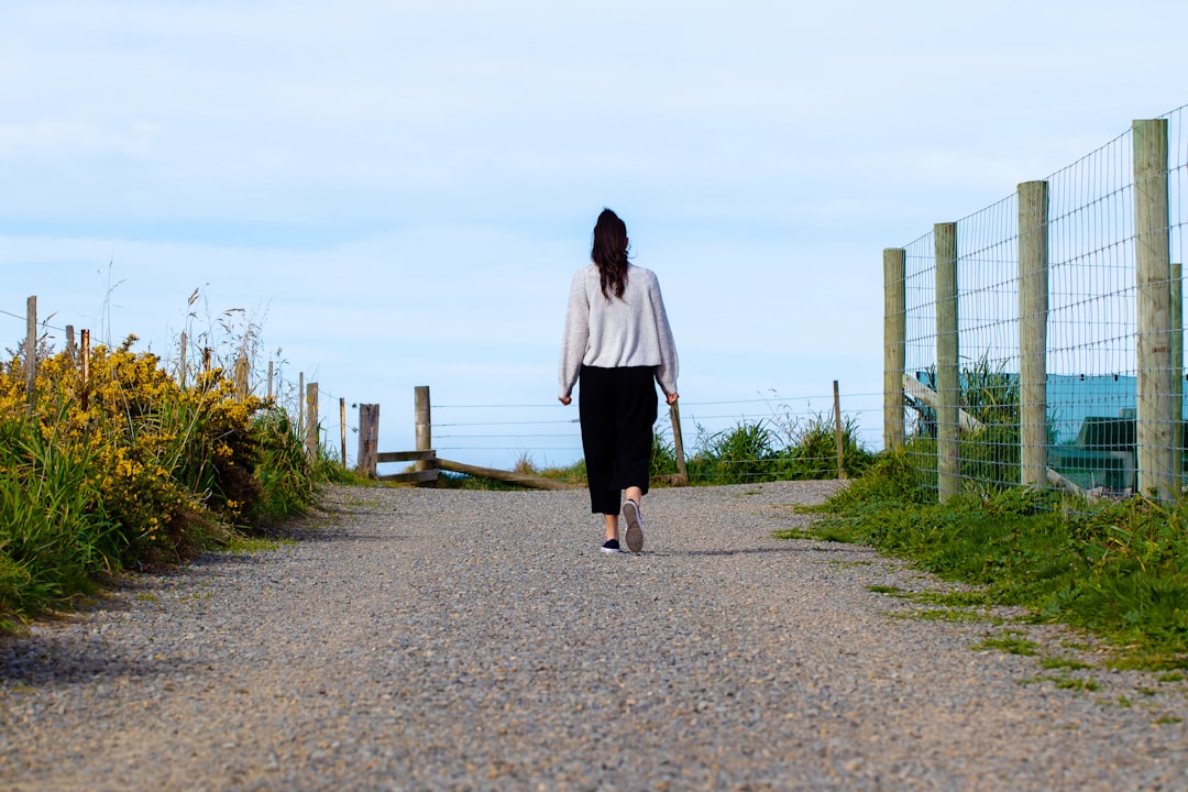 woman walking along path