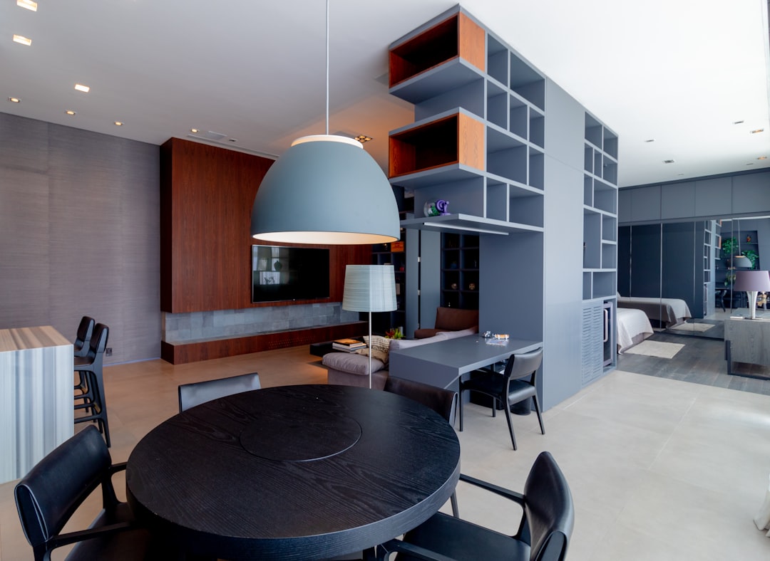 a dining room table and chairs in a room