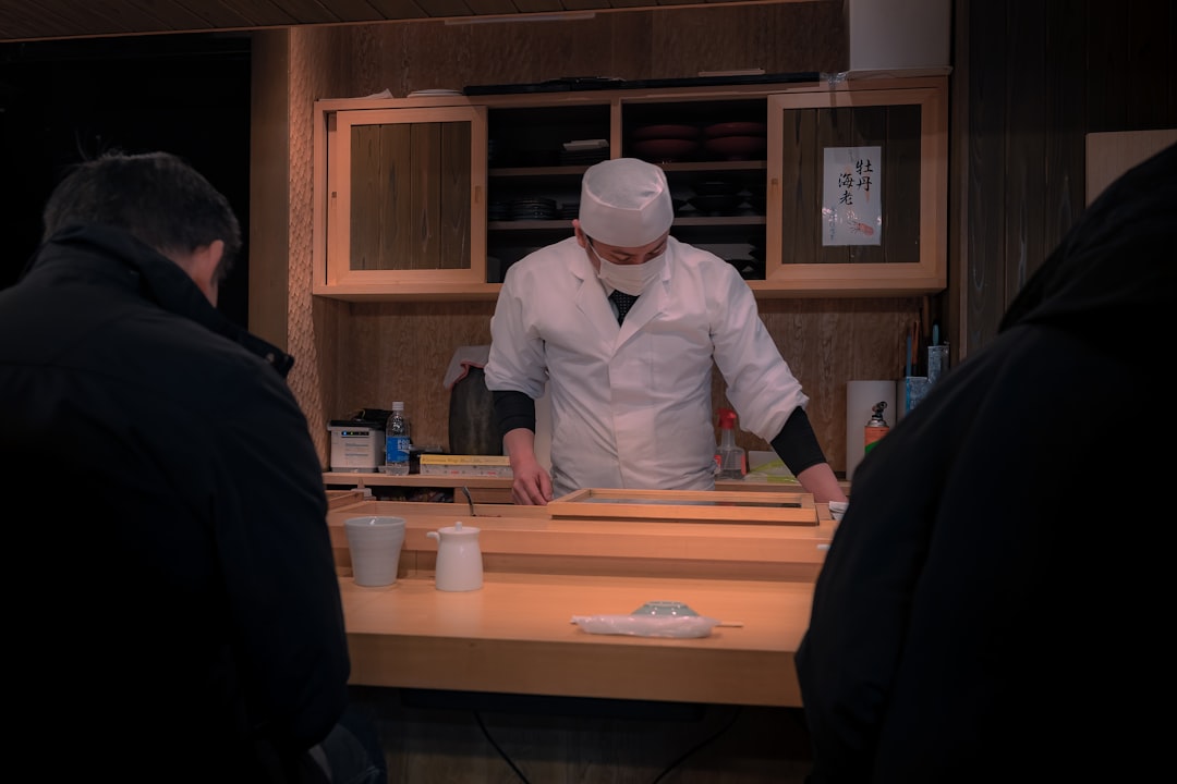 a man in a chef's hat preparing food in a kitchen